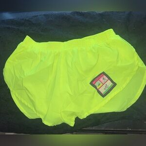 Tri-fit neon yellow shorts/ size large would fit best a medium or large
